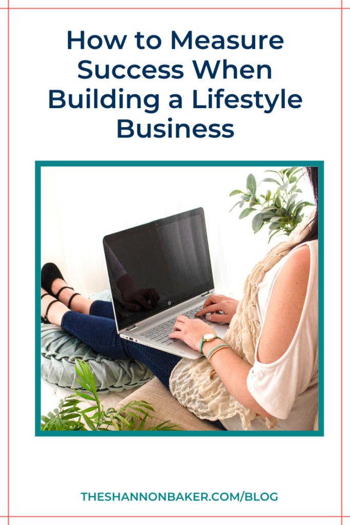 The words "How to Measure Success When Building a Lifestyle Business"  above image of a woman sitting on an upholstered chair with her feet on an ottoman and a laptop on her desk