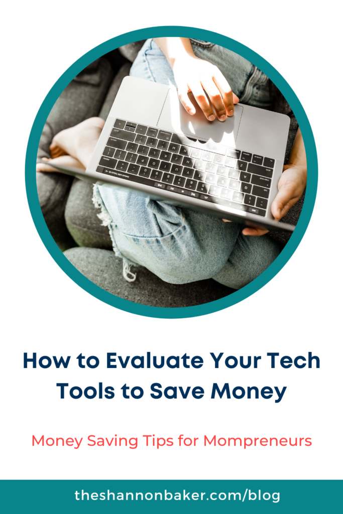 Circle image of woman wearing jeans sitting on a gray sofa with a laptop on her legs above the words "How to Evaluate Your Tech Tools to Save Money+ - Money saving tips for mompreneurs
